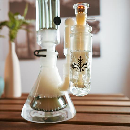 90 degree 18mm ash catcher being used on a bong