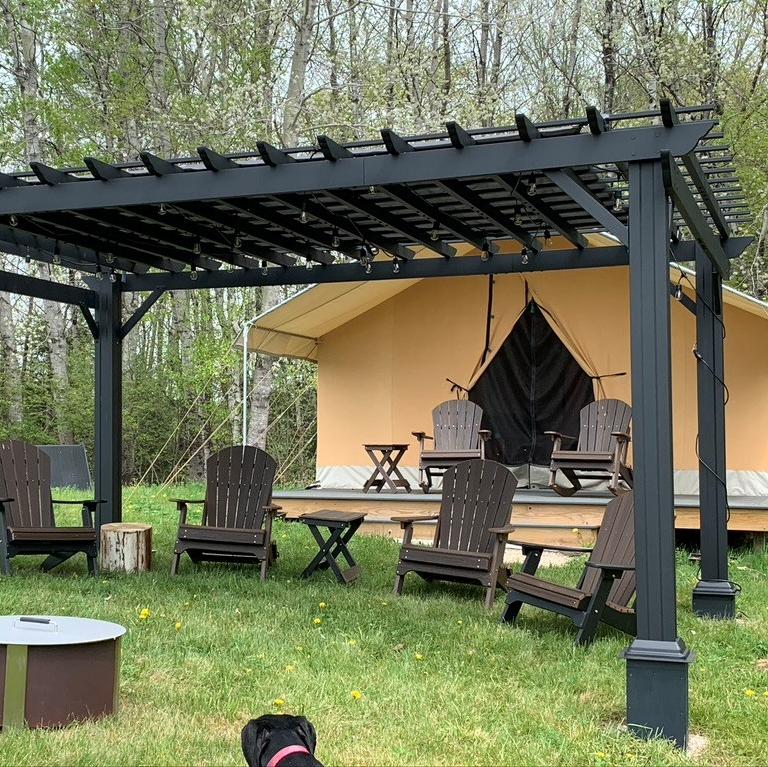 Pergola using black flat plate on a sloped hill