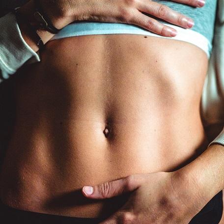 Woman holding her stomach