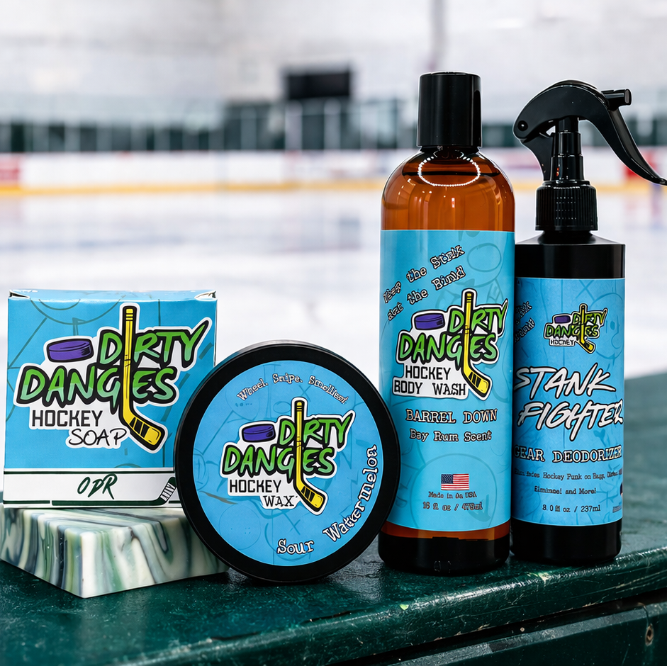 Dirty Dangles hockey soap, stick wax, body wash and gear deodorizer displayed on rink boards