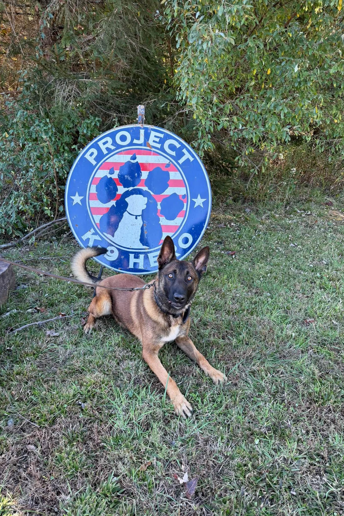 mpc hhudson in front of pk9h sign
