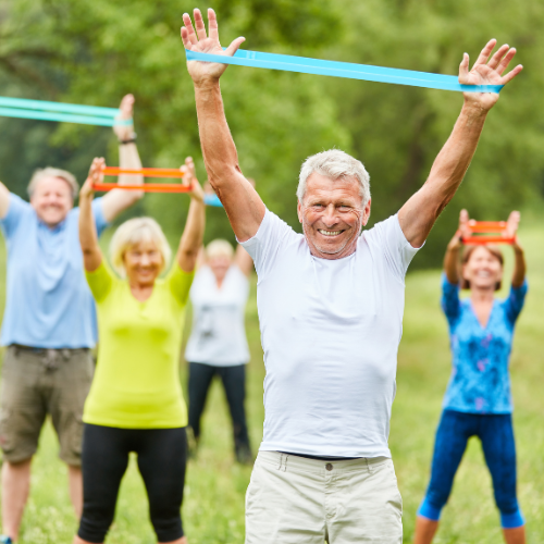 group of older adults exercising outside