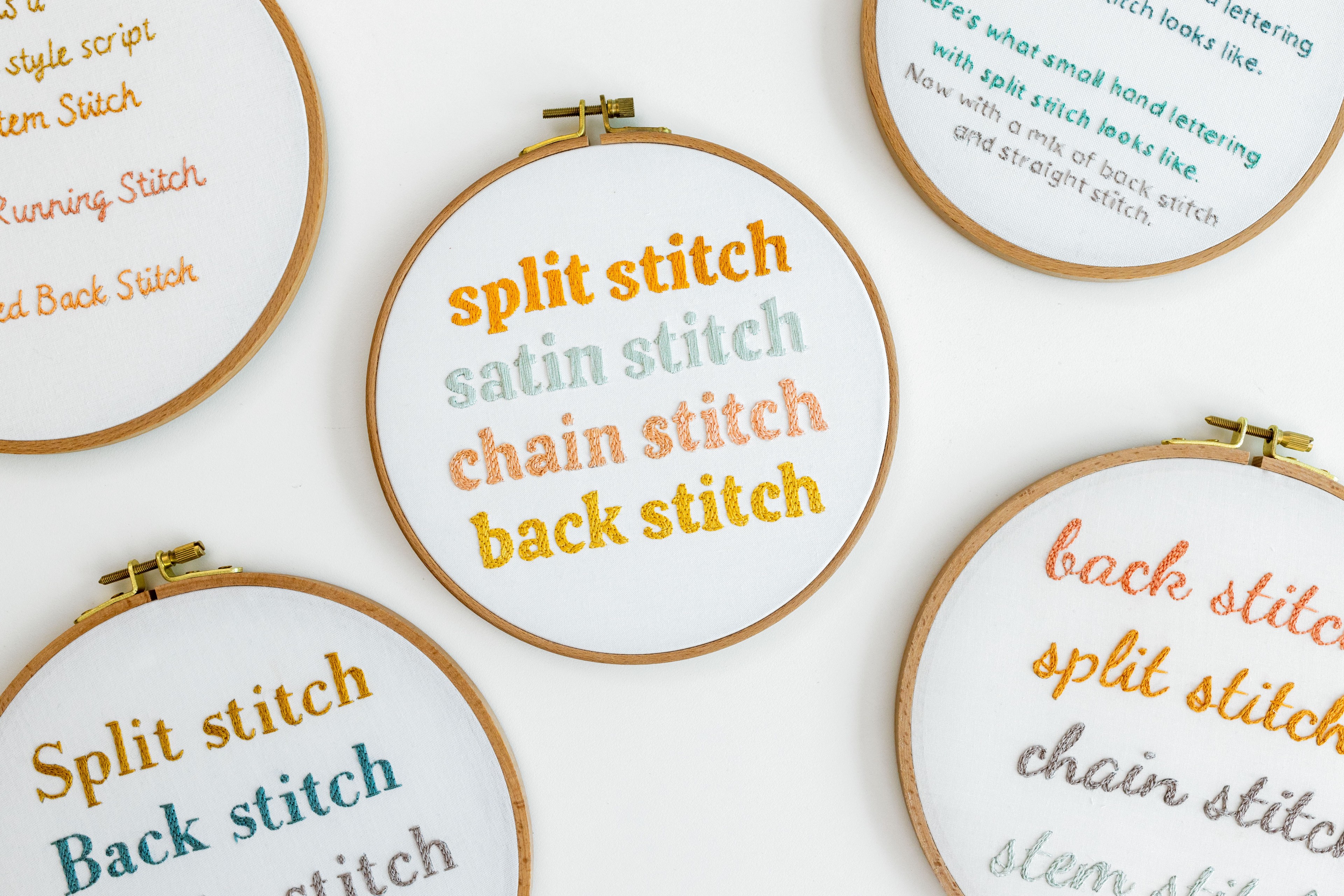 This is an image of different hoops with embroidered words on them.