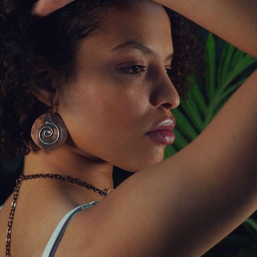 A model wearing Junebug's Journey Copper Earrings