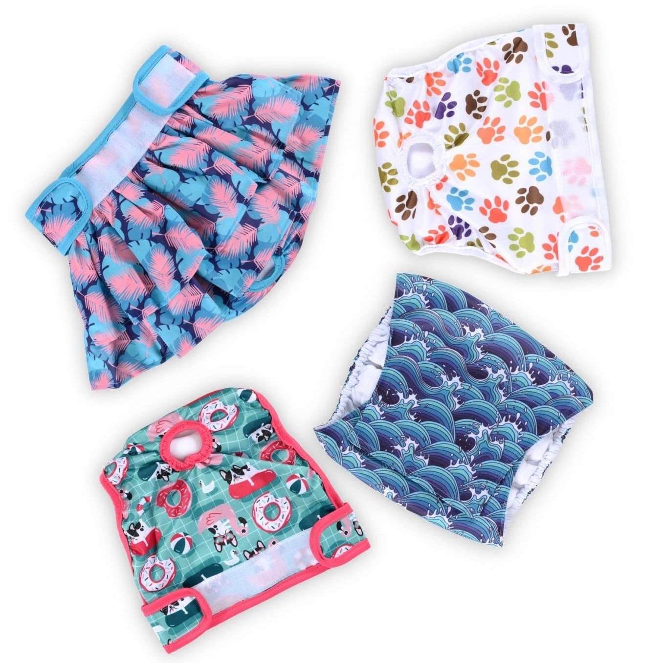 A variety of washable diapers for dogs laid out on a white surface