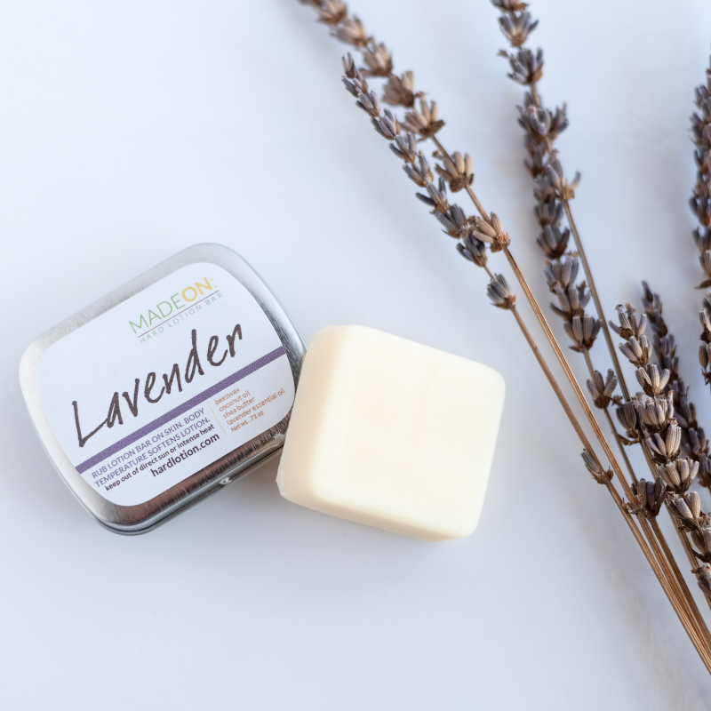 Lavender lotion bar with sprig of lavender