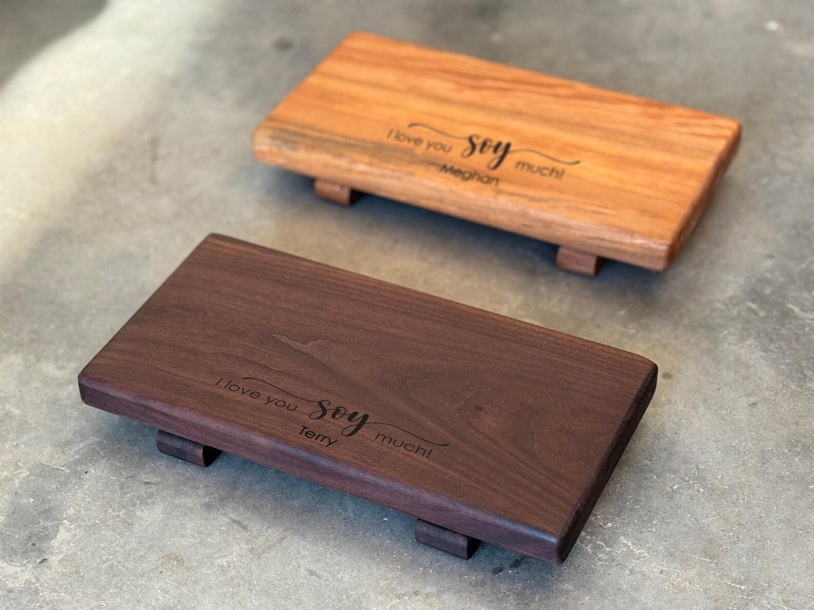 A maple and walnut wooden sushi plate set with engravingings