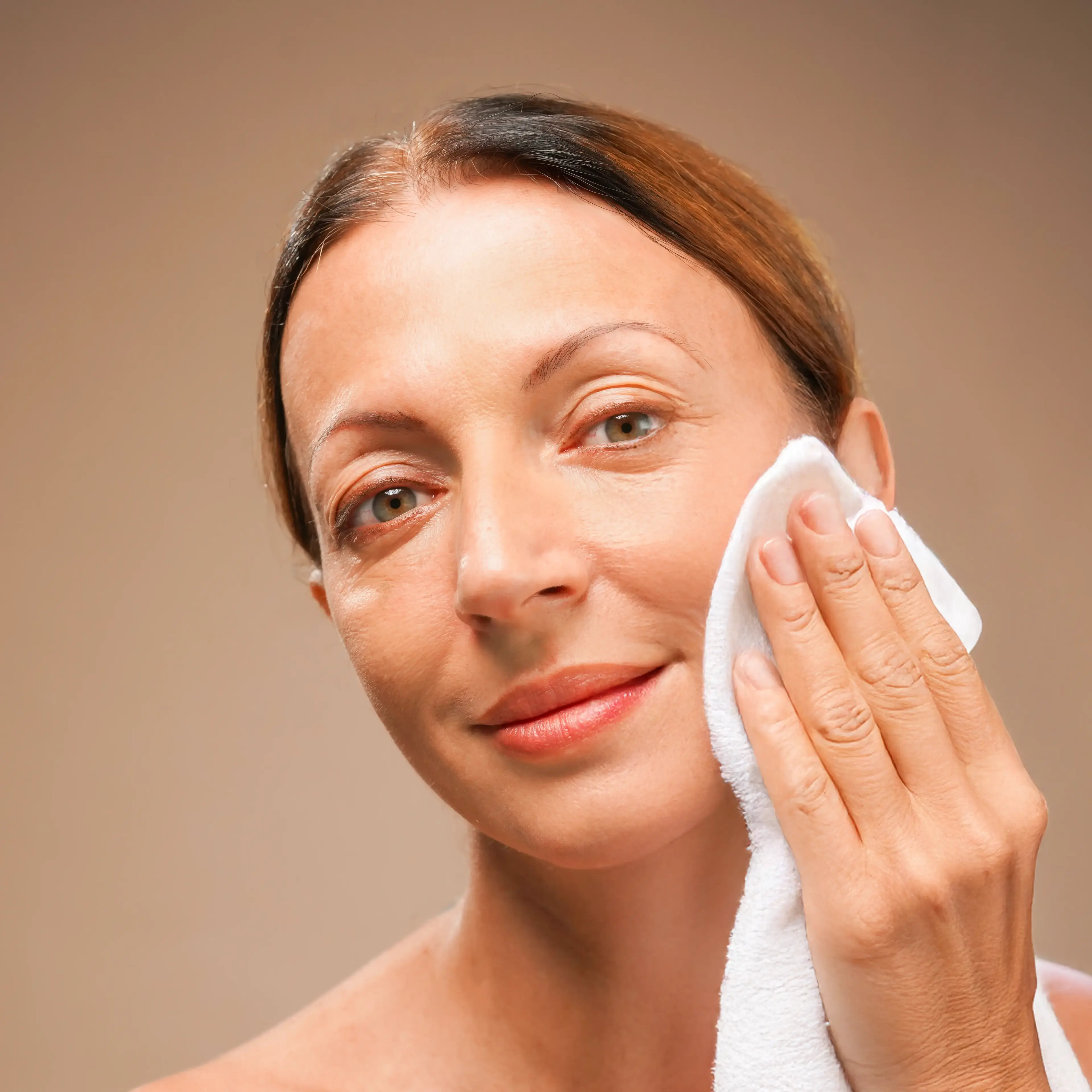 step 2. Woman drying her face