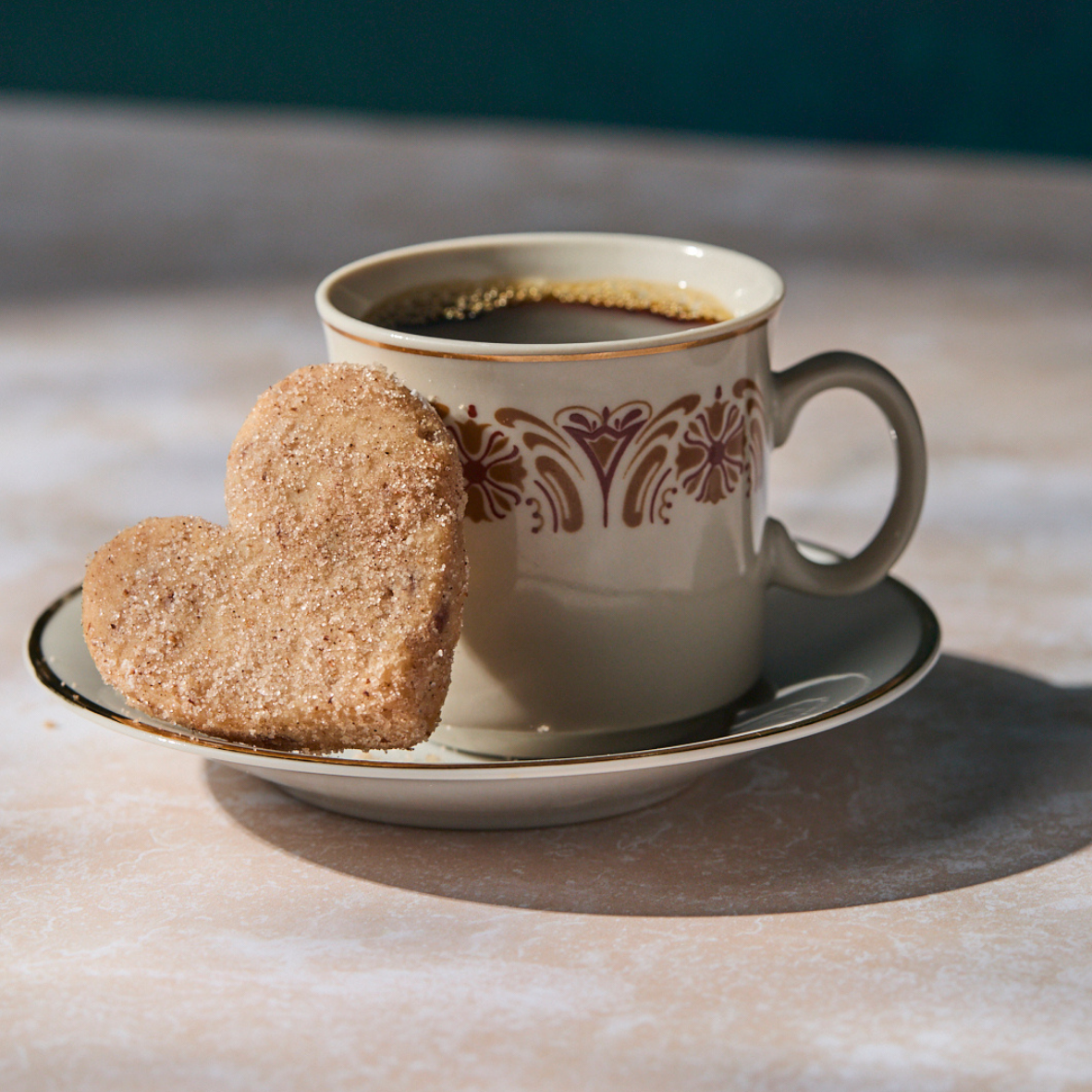 cut of coffee with heart shaped cookies