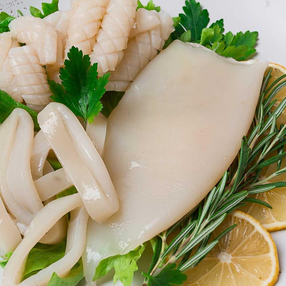 Fresh squid , raw, carcass, cut into rings, top view, no people,