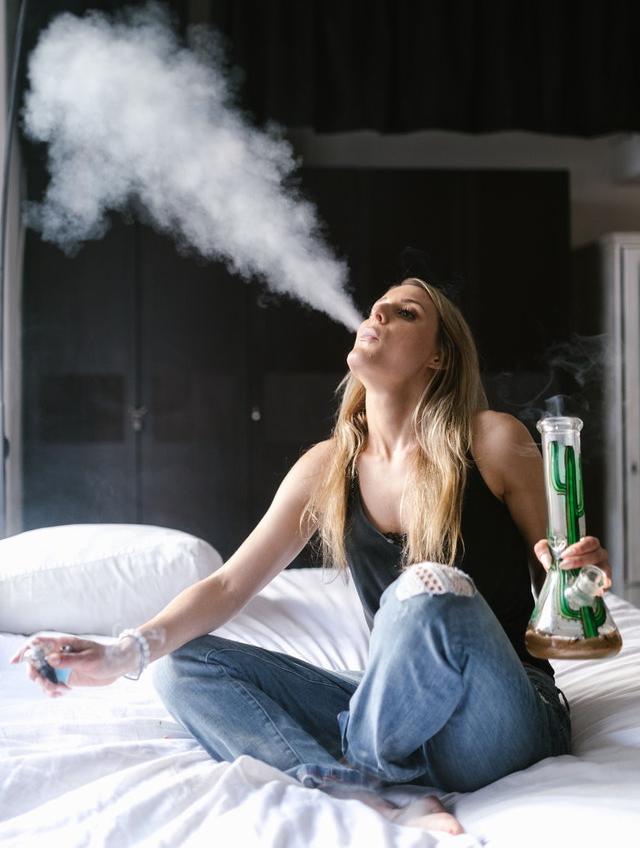 woman smoking a bong