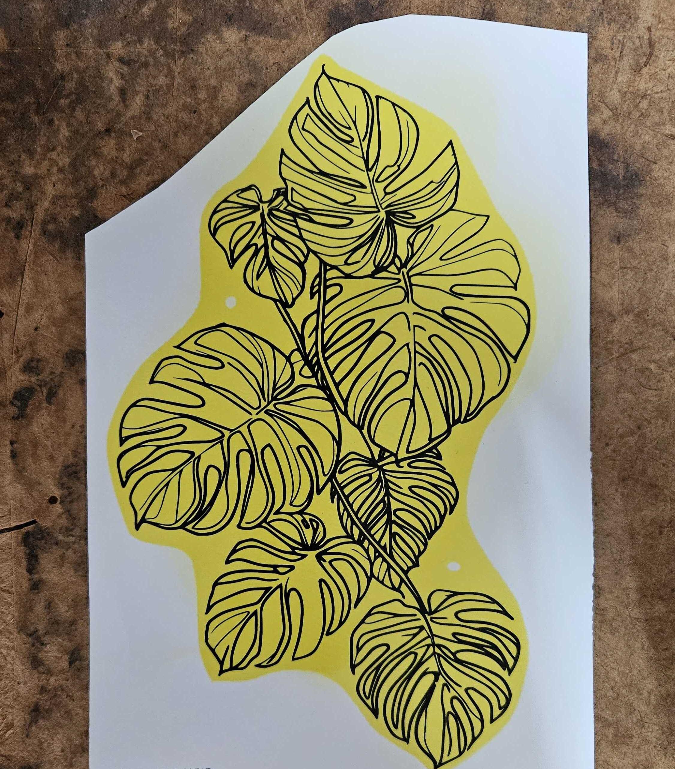 A sheet of kiln-fire glass decals featuring custom designs with yellow temporary backing. The yellow disappears during the kiln-firing process, leaving a permanent fused design. Part of the customization kit for a 3D custom bong builder.