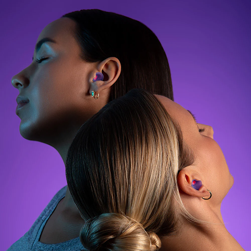 Two girls wearing earplugs for napping after eating.
