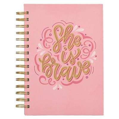 pink spiral journal text says "she is brave"