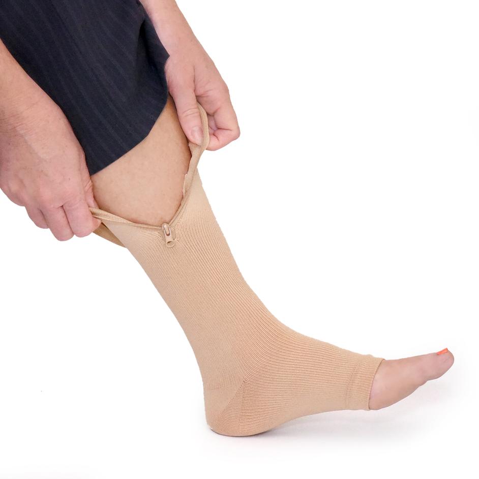 Just Slip our Sock on your foot slide it easily up your leg then zip