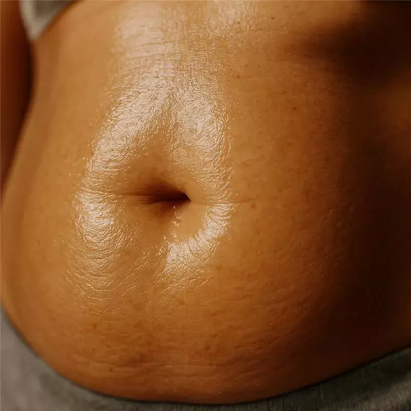 woman massaging belly with Balaayah