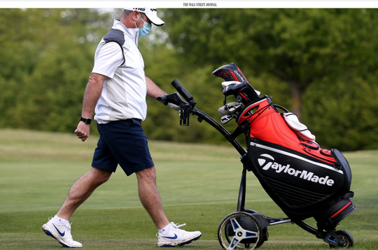 A golfer uses a pushcart at London's West Essex Golf Course ALEX PANTLING-GETTY IMAGES