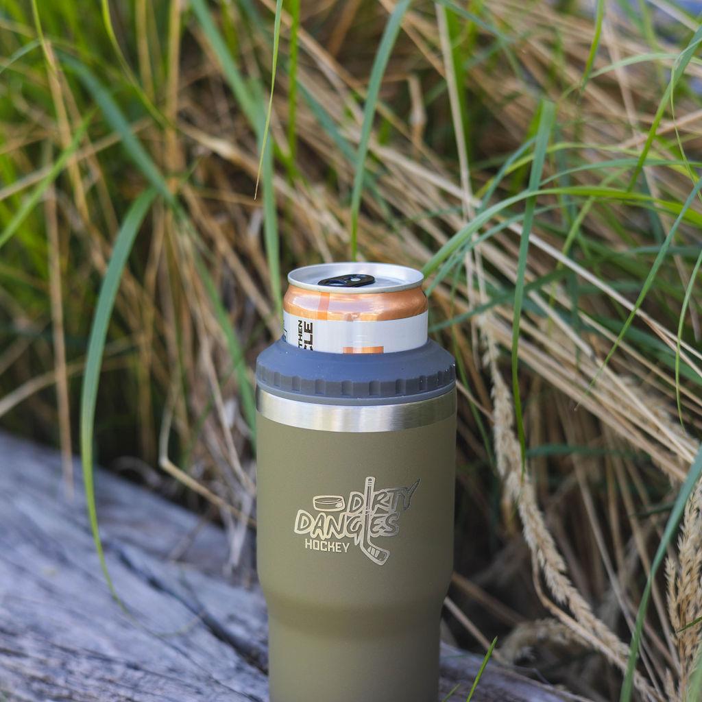 A tactical green dirty dangles logo 4 in 1 insulated drink tumbler can cooler outside on a piece of wood.