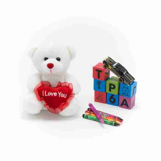 A six inch white bear with a red heart.