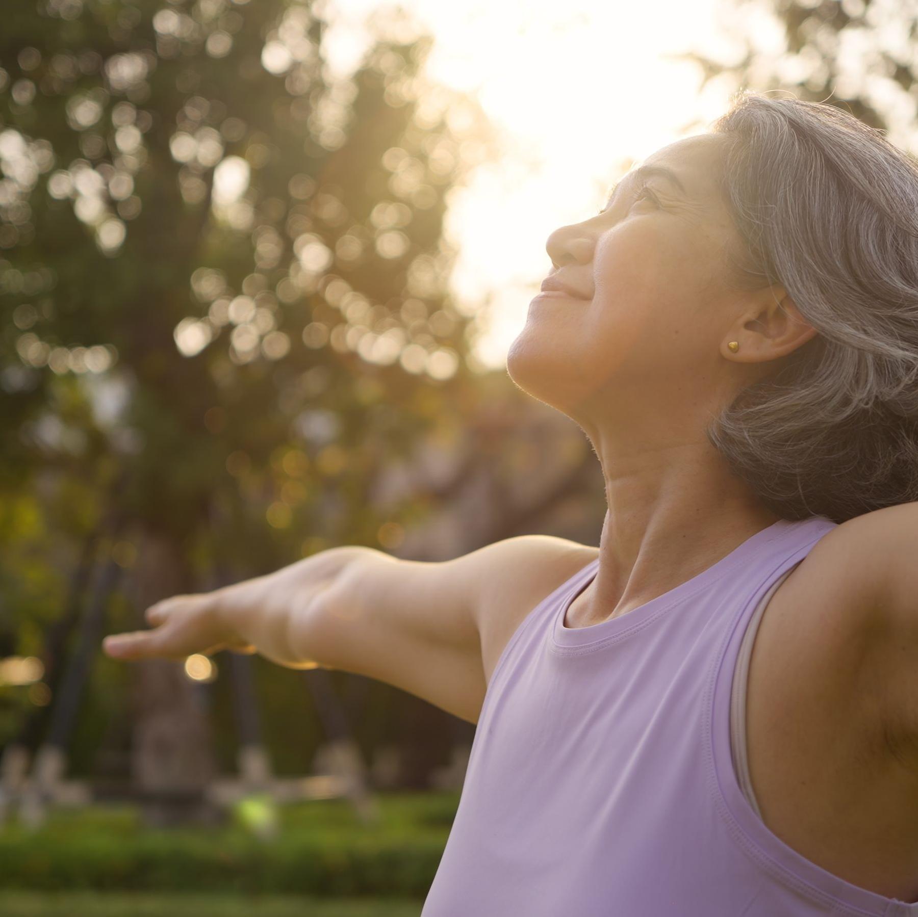 New World Wellness Woman Stretching
