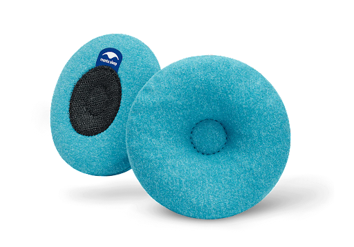 Two blue cooling eye cups for a sleep mask. One cup shows the micro hook and loop closure backing. The other cup has an indentation in the center.