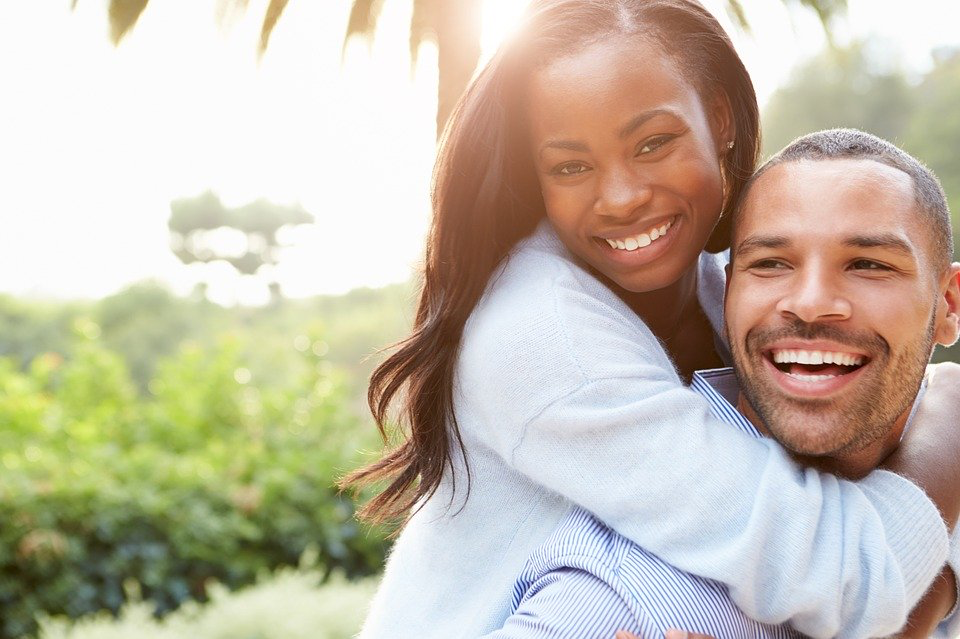 Woman hugging man