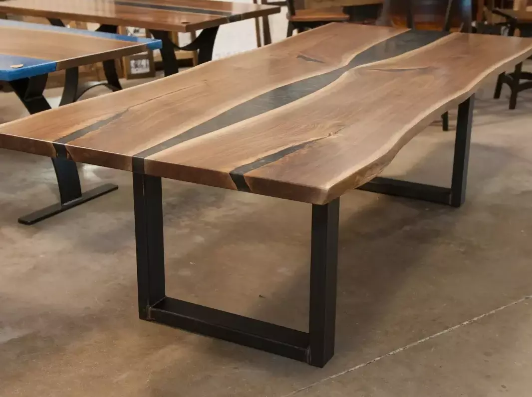 dark walnut river table with steel U-base