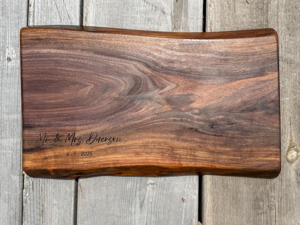 walnut live edge charcuterie wedding signing board engraved with name and date.