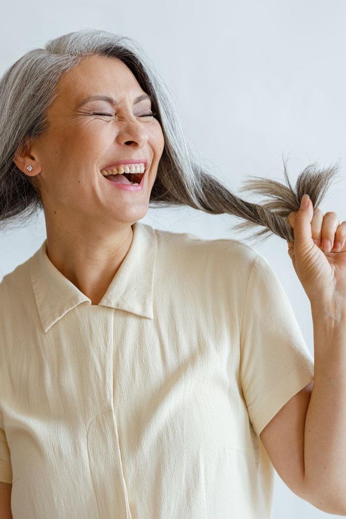 Delighted woman with healthy, long hair