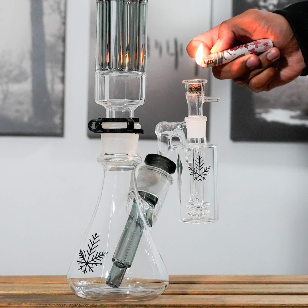 about to light an ash catcher on a bong