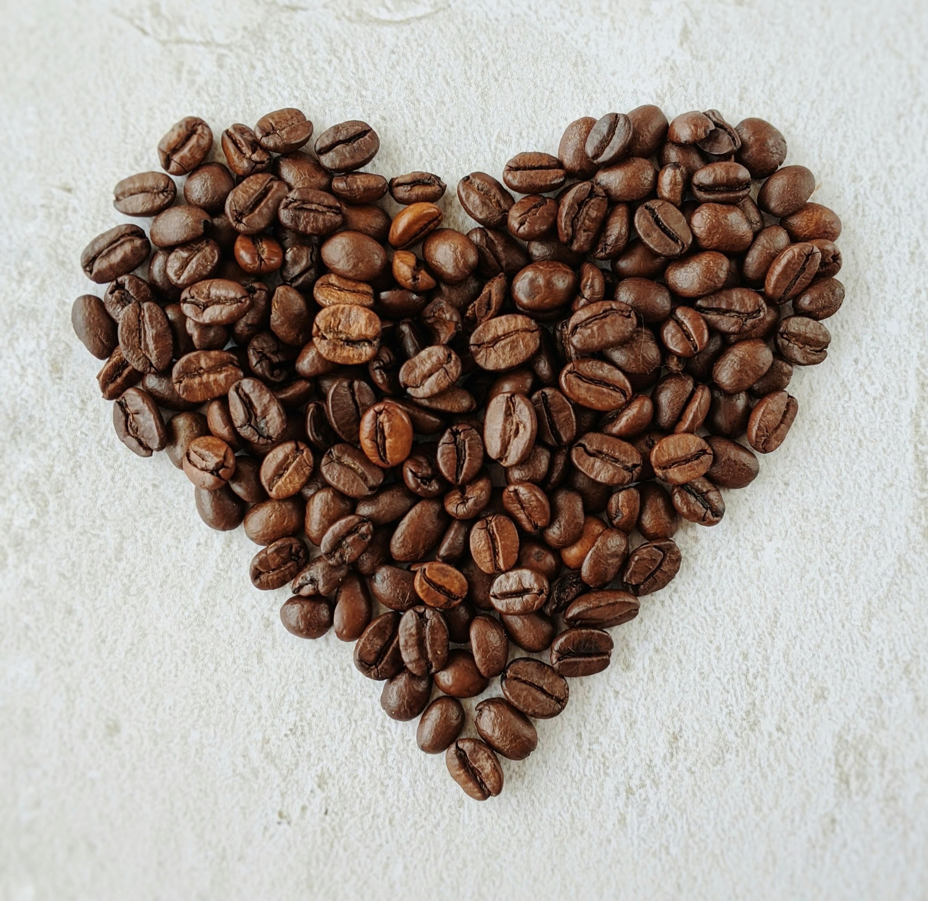Woman Smiling with a cup of Coffee on her hands
