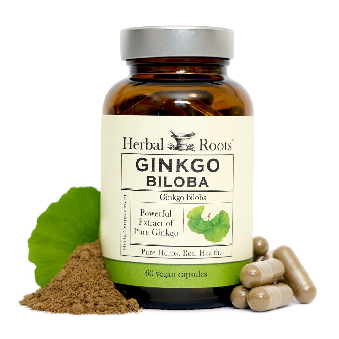 Bottle of Herbal Roots Ginkgo Biloba with capsules on the right of the bottle and a small pile of ginkgo powder with a ginkgo leaf on the right of the bottle.