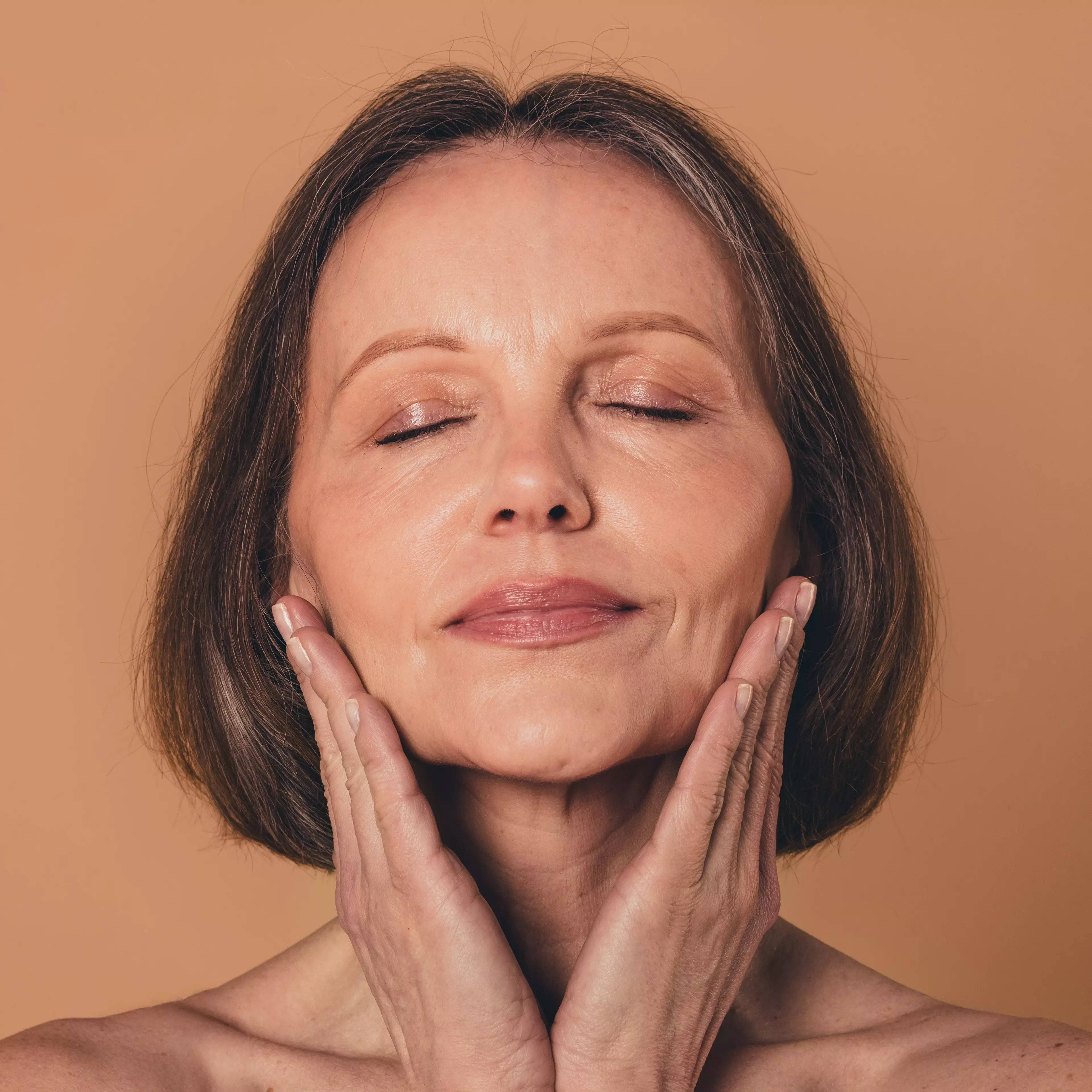Sneha- a woman massaging her face with oil