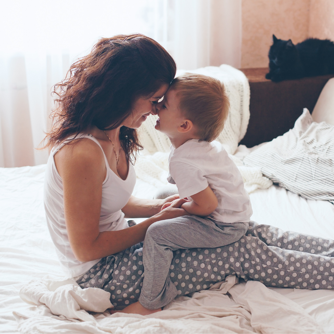 Mother and baby in crib
