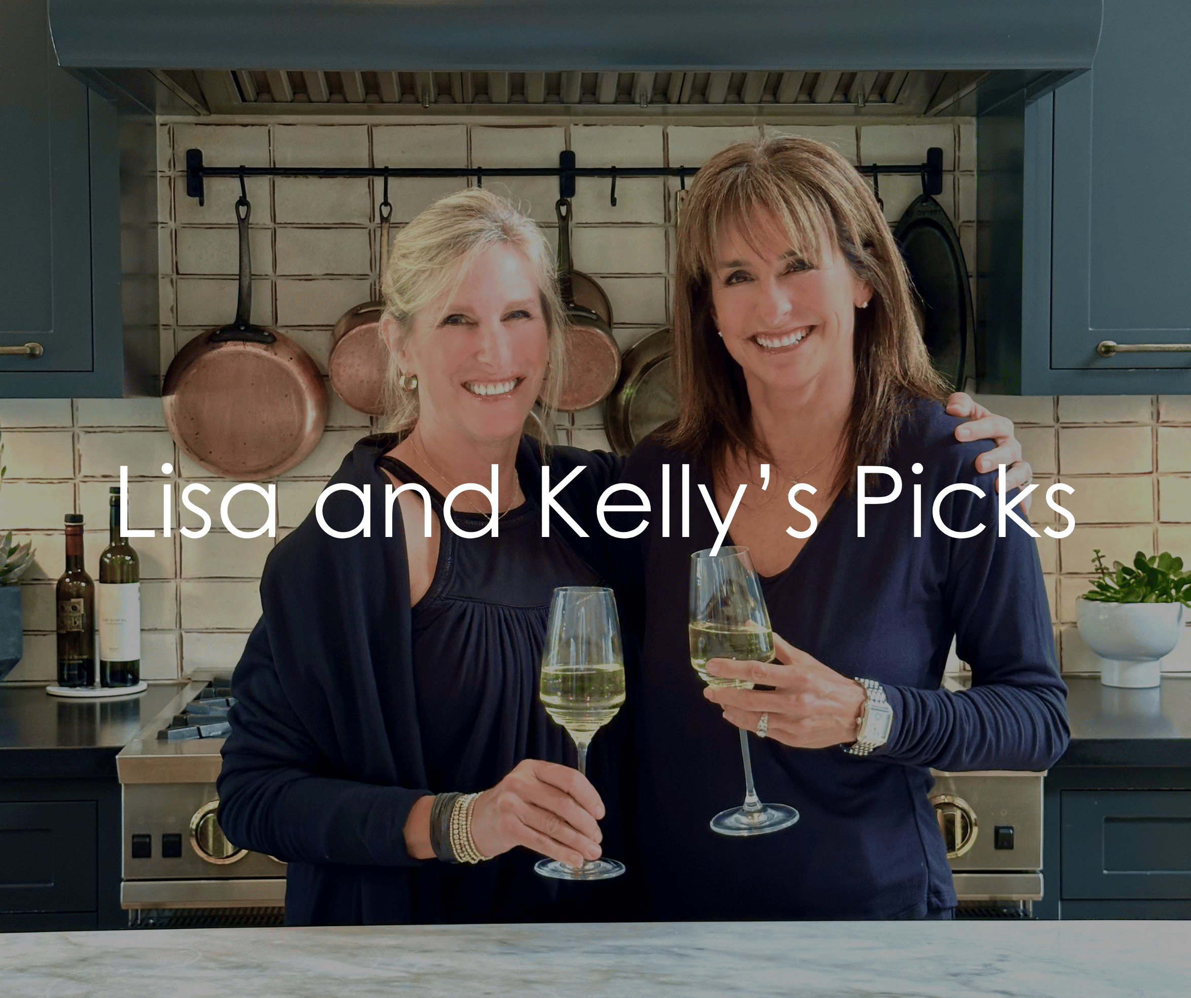 lisa and kelly holding champagne in celebration