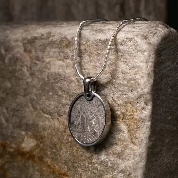 The Meteorite Circular Pendant is a Meteorite Pendant crafted with real meteorite